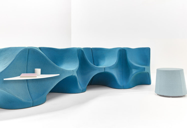 aqua upholstered sinuous modular lounge seating in white room