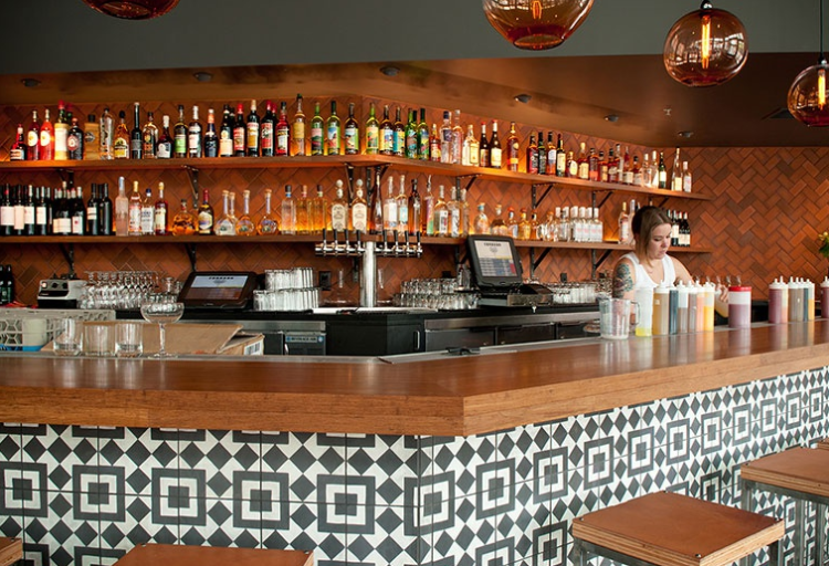 modern bar with black and white Moroccan-inspired geometric tile
