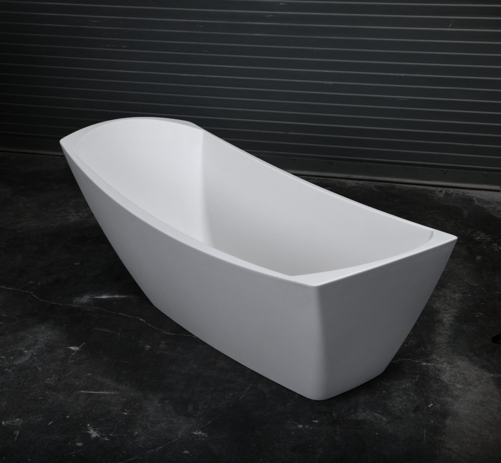 modern white slipper-inspired bathtub with black background
