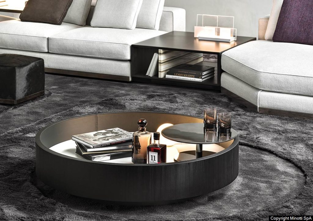 round coffee table with recessed interior storing liquor and books