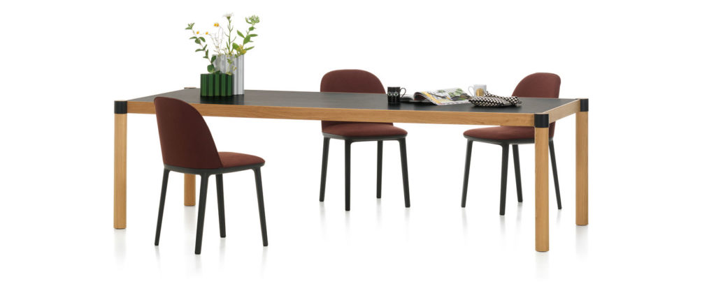 Vitra Cyl Table in dark veneer and light wood with three chairs