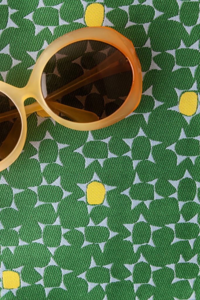 Architex Some Like it Mod green clover pattern with orange-frame sunglasses