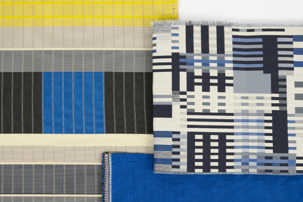 Designtex + Albers textile samples with lines in blue, black, grey, yellow, and white