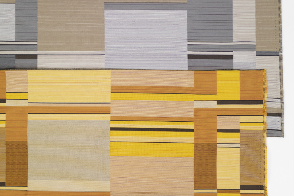 Designtex + Stölzl textile designs of squares and lines in yellow, black, grey, and various browns