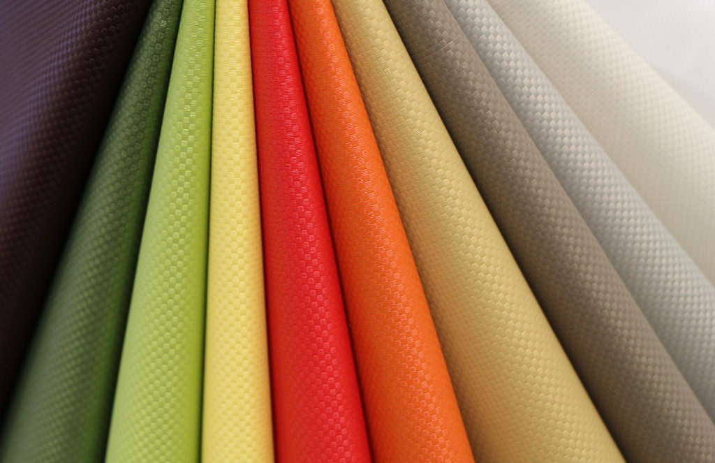 Ultrafabrics textiles close-up of 10 different colors from portfolio, including red, orange, yellow, green 