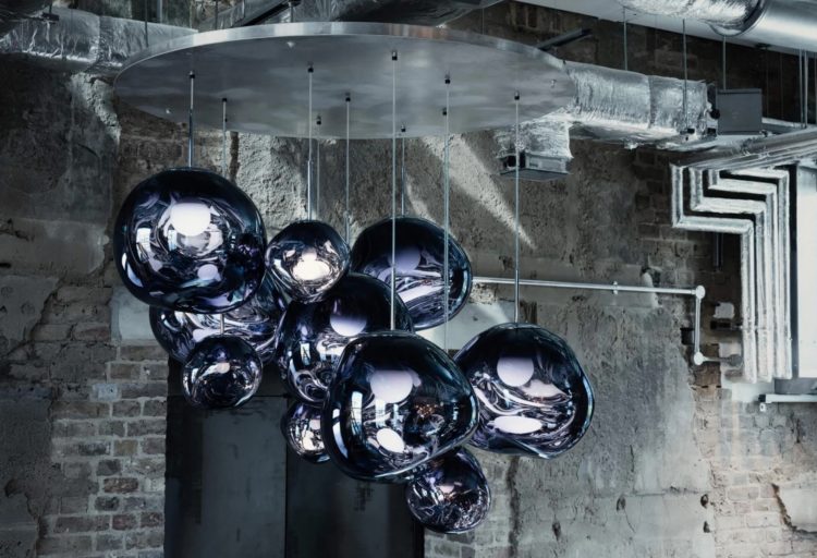 Tom Dixon Melt Pendant blue cluster of suspension lamps in industrial setting with exposed brick walls
