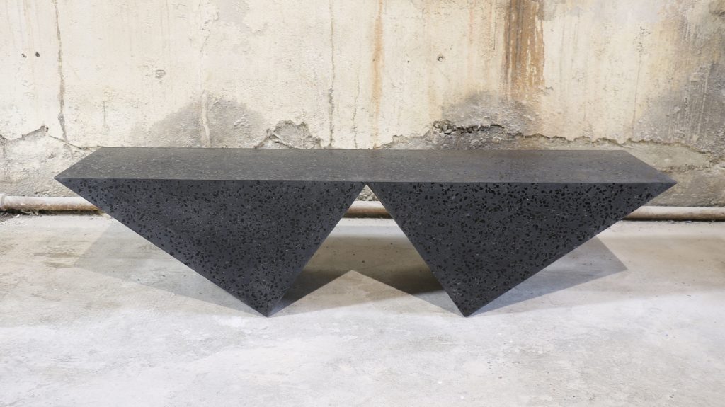 Zachary A. Black Terrazzo table looks like two triangles upside down with flat top