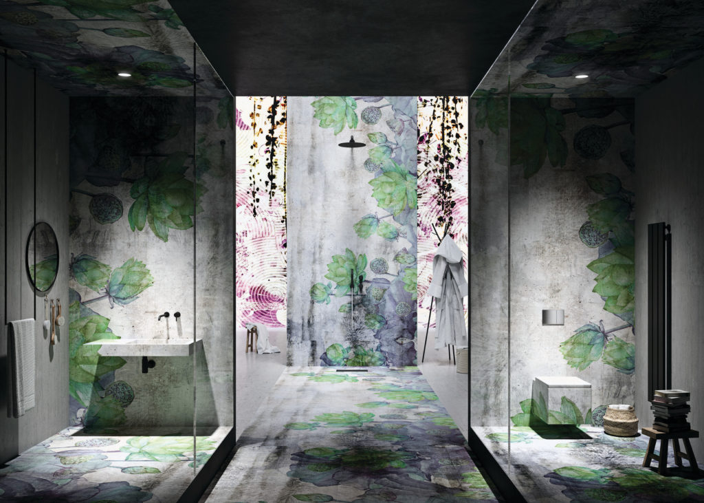 Instabilelab wallpaper pattern on floor, walls, and ceilings same pattern of fanciful trees and plants as in earlier picture in corridor with two glass partitioned rooms: one wit sink and shower and other with toilet