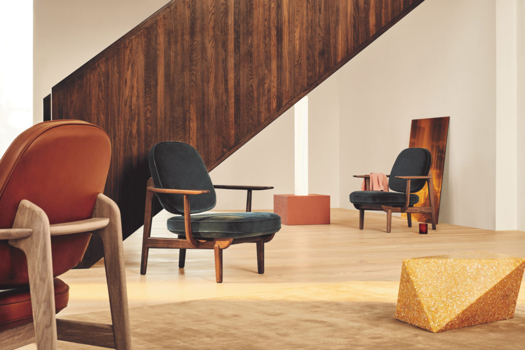 Fritz Hansen Fred Chair two chairs in green velvet andone in orange leather in lobby