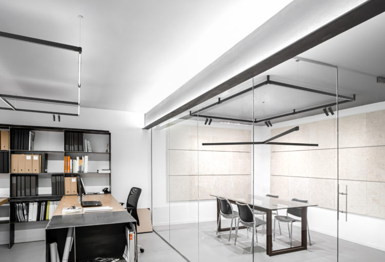 Flos Diversion Lighting many modules mounted in square and linear shapes in nice office with bookshelf