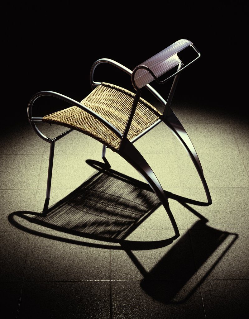 Iosa Ghini Juliette Chair rocking chair with black streamlined metal frame and cord seat