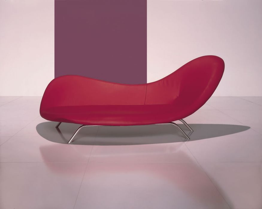 Iosa Ghini Shape Armchair red loveseat with curving back that's higher at one end and metal legs