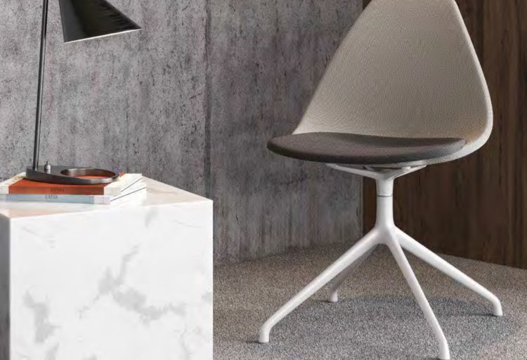 Case Furniture's Ziba Chair with grey back and black upholstered seat in small office setting with desk and table lamp