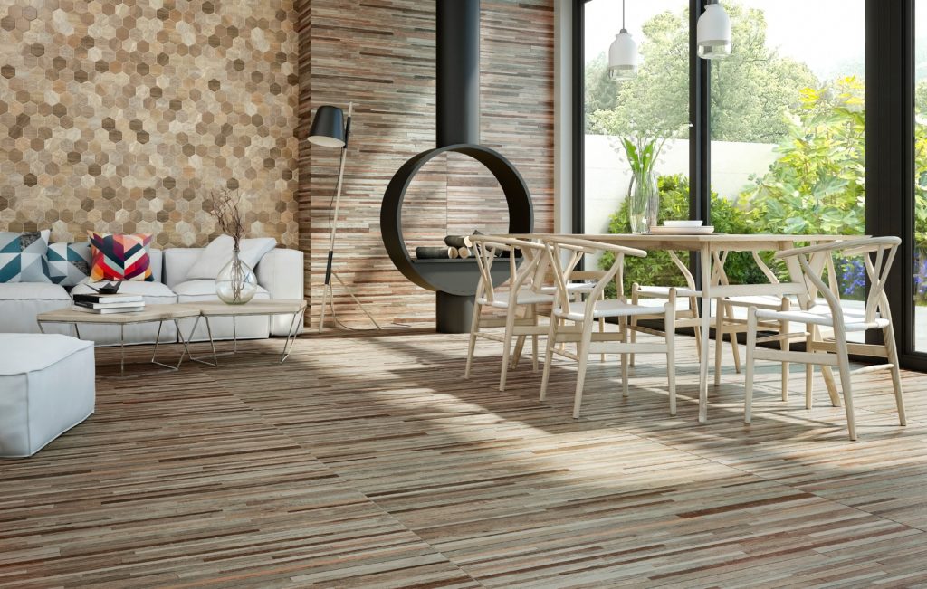 Tile of Spain 2020 designs Natural Wood linear pattern on floor and end grain pattern on walls of open dining area with large window and modern fireplace