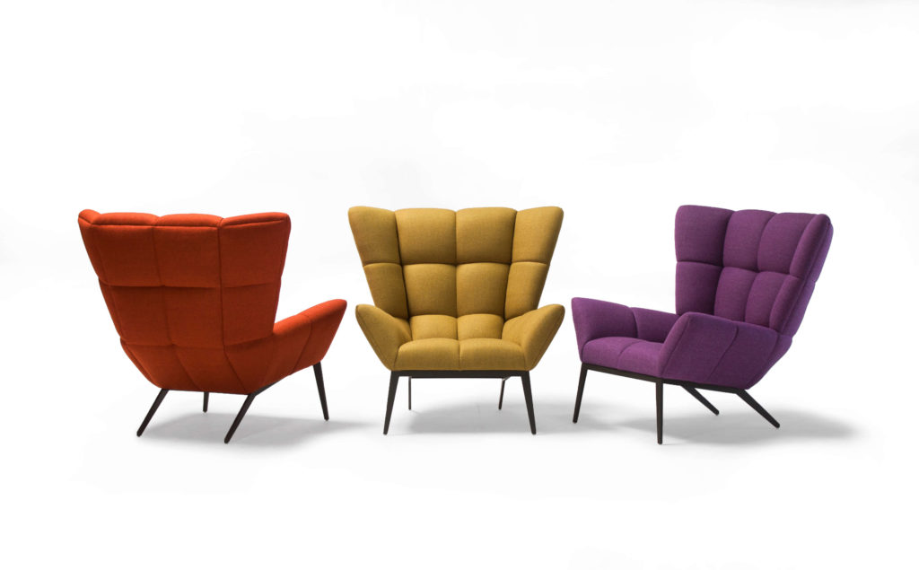Vioski Tuulla Chair three chairs at different angles in red, mustard, magenta