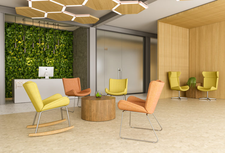 ERG International's Albury Lounge many chairs in peach and yellow with different bases in open workspace and round wooden table