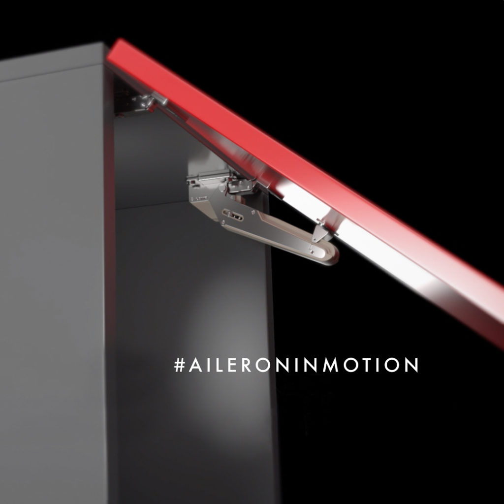 Aileron Lid Stay Hinge System side view on gray cabinet with red door partially open
