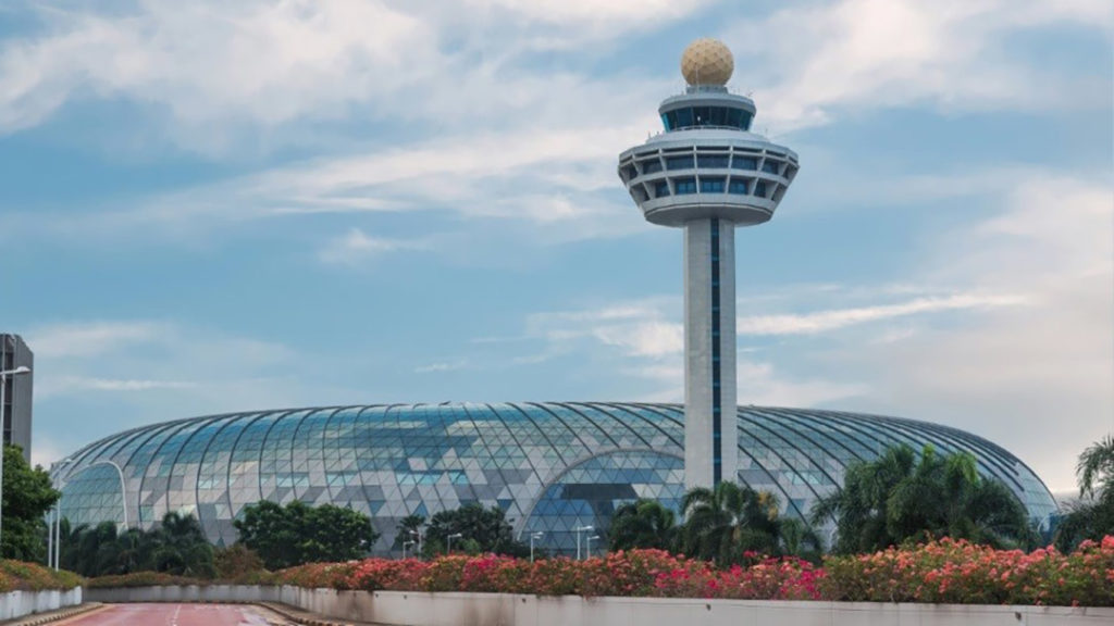 Vitro Architectural Glass in Jewel Changi Airport exterior view with tower and glass dome and landscaping in foreground
