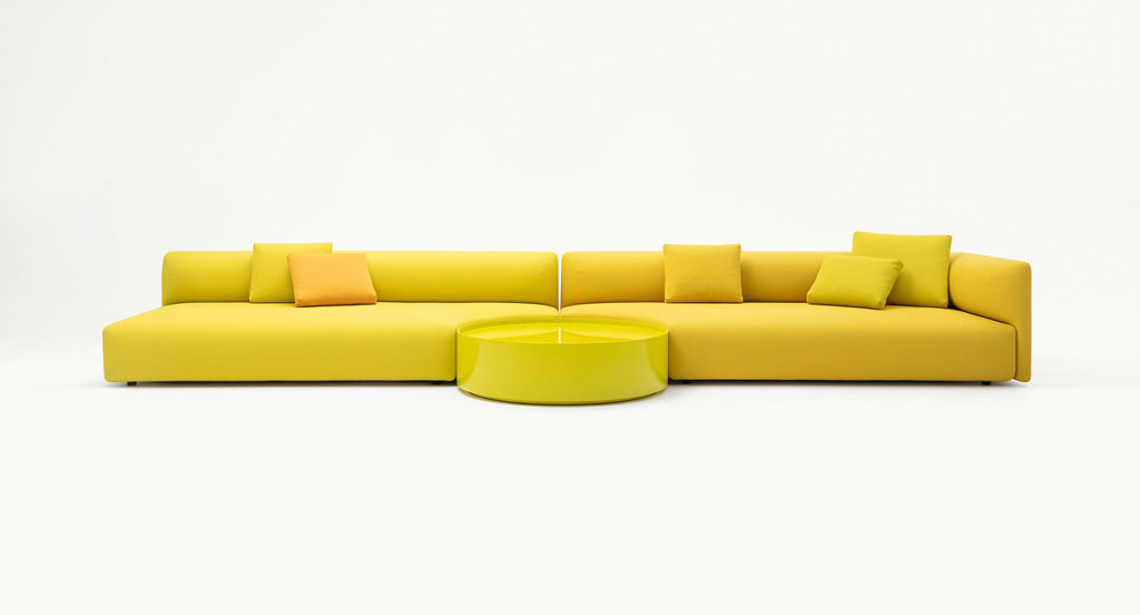Paola Lenti Walt Seating two three-seat yellow sofas with circular table in center front view