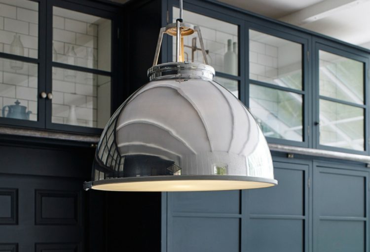Titan Pendant chrome aluminum in kitchen with backdrop of blue/gray wall with windows