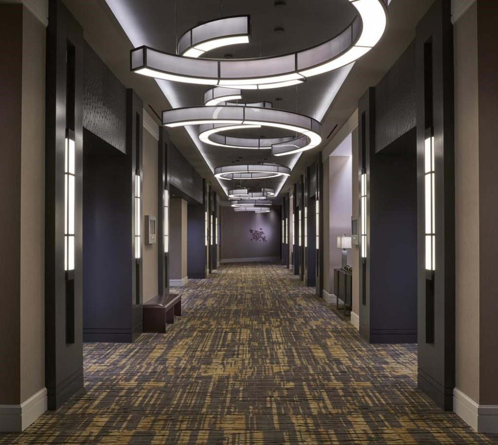 BDL Hospitality Lighting semi-circular pendants in hallway at Raleigh, North Carolina StateView Hotel