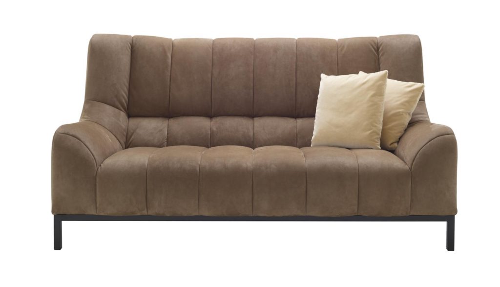 Ligne Roset Phileas Sofa medium sofa in tan upholstery with two white pillow on one side