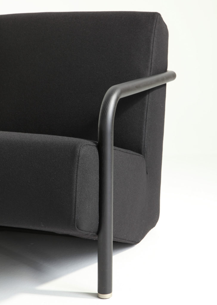Porro Lullaby Armchair close view in black wool with black painted wood arms/legs
