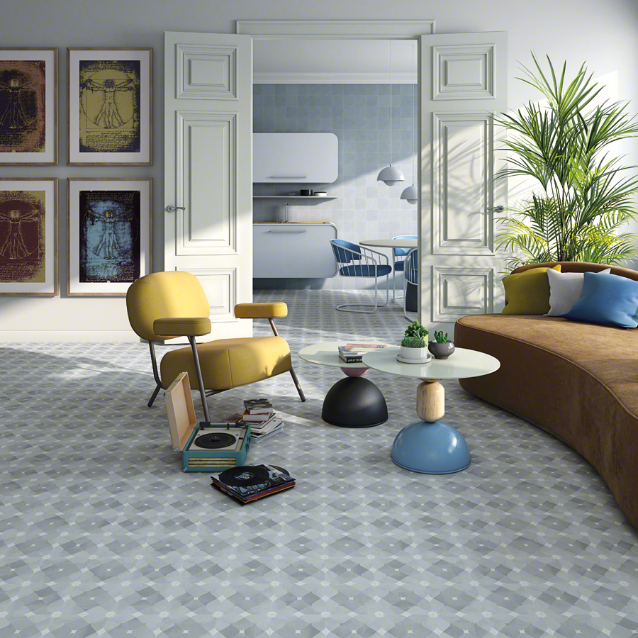Pop Tile Cavern Sixties Style of intersecting diamonds in palette of blue and white in open salon with nice yellow chair and brown curved sofa