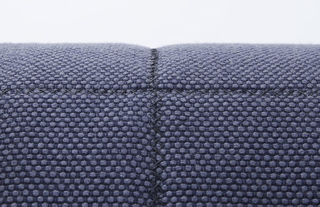 Unika Vaev's Bond Street Collection close up of fabric in inky blue with raised dots against darker surface