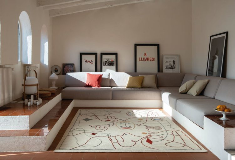 Nanimarquina Silhouette Rug in nice living room with Mexican tile floor and large sectional couch