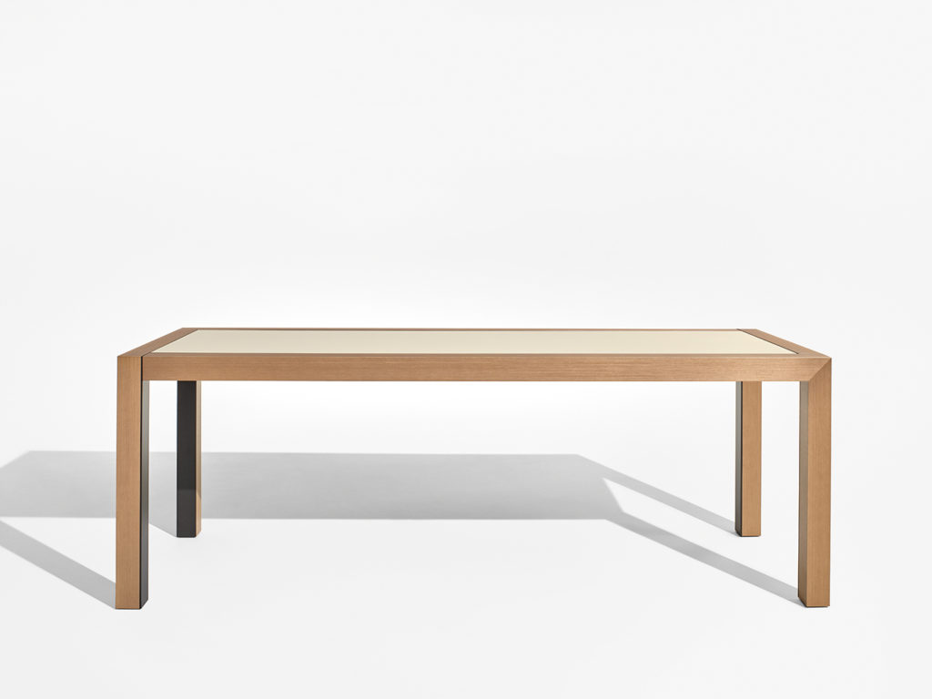 Nucraft's Epono Table Front view with white laminate top and natural wooden frame/legs