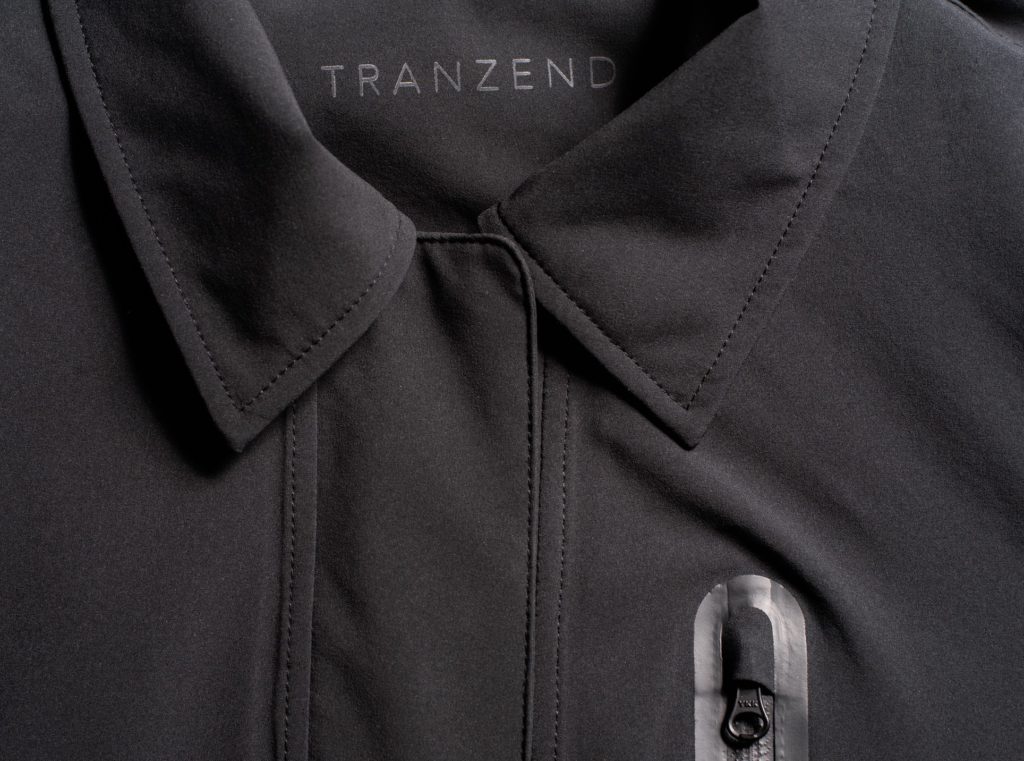 Ultra Coat detail of top front of jacket with neck cuffs and Tranzend logo visible