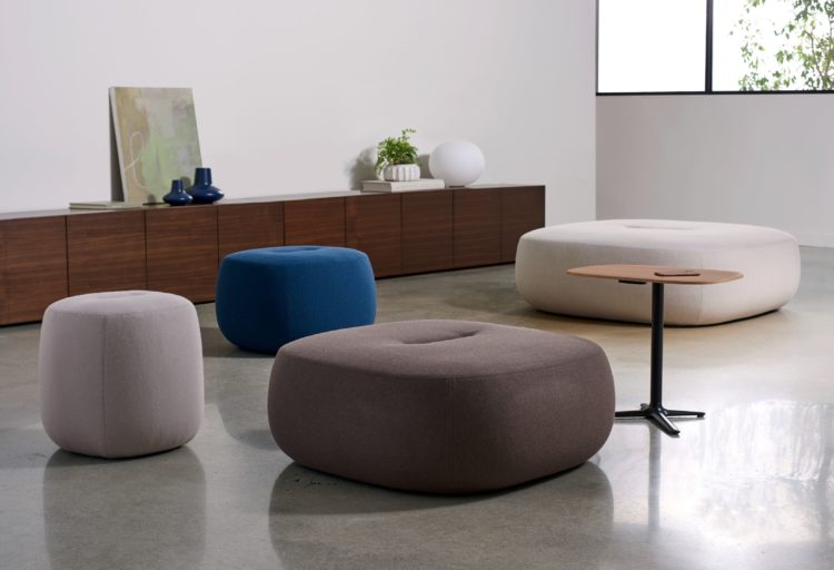 Rho Ottomans four ottomans different colors and sizes with small coffee table in workspace