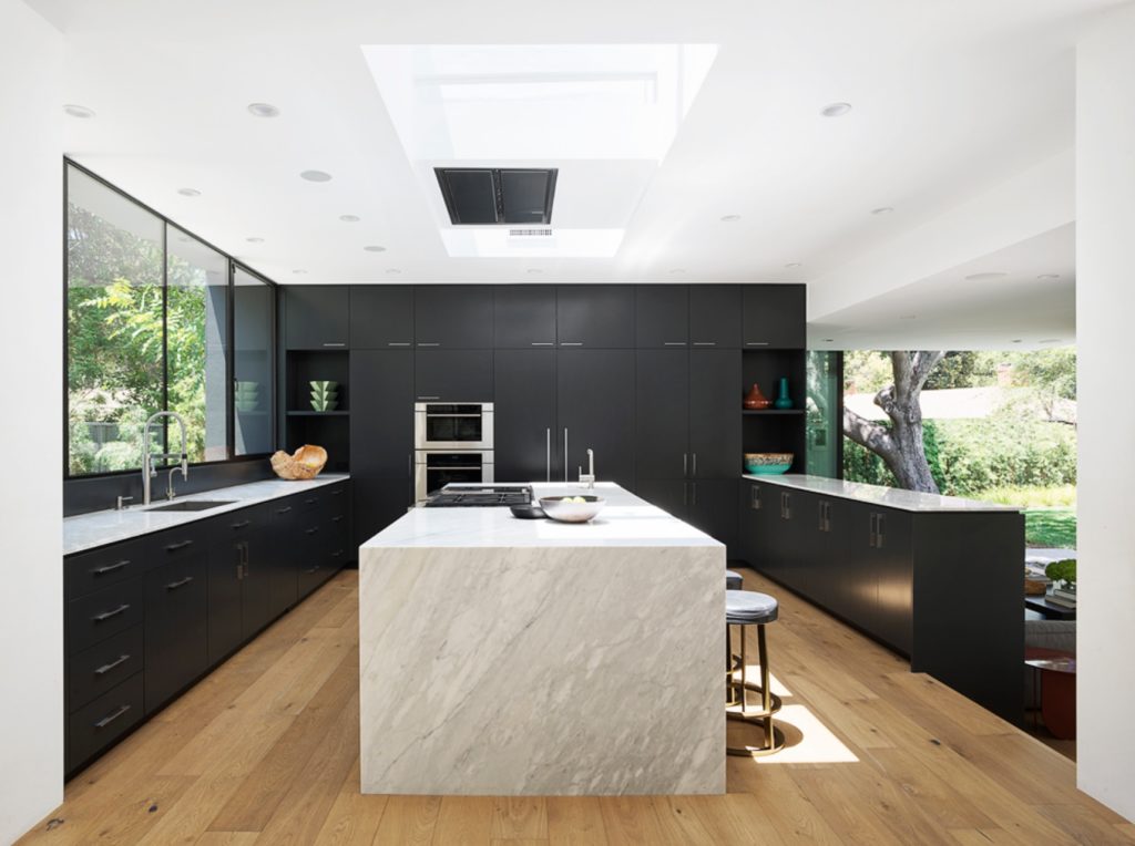 Assembledge+ Laurel Hills kitchen with marble island and dark cabinetry