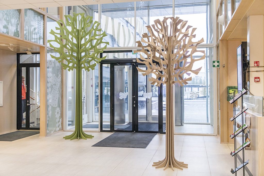 Unika Vaev Lovi Acoustic Trees green and beige tall in entrance vestibule