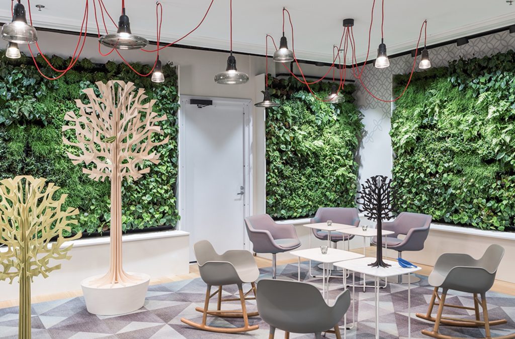 Unika Vaev Lovi Acoustic Trees in break room with modern chairs and green walls