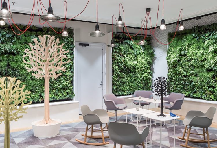 Unika Vaev Lovi Acoustic Trees in break room with modern chairs and green walls
