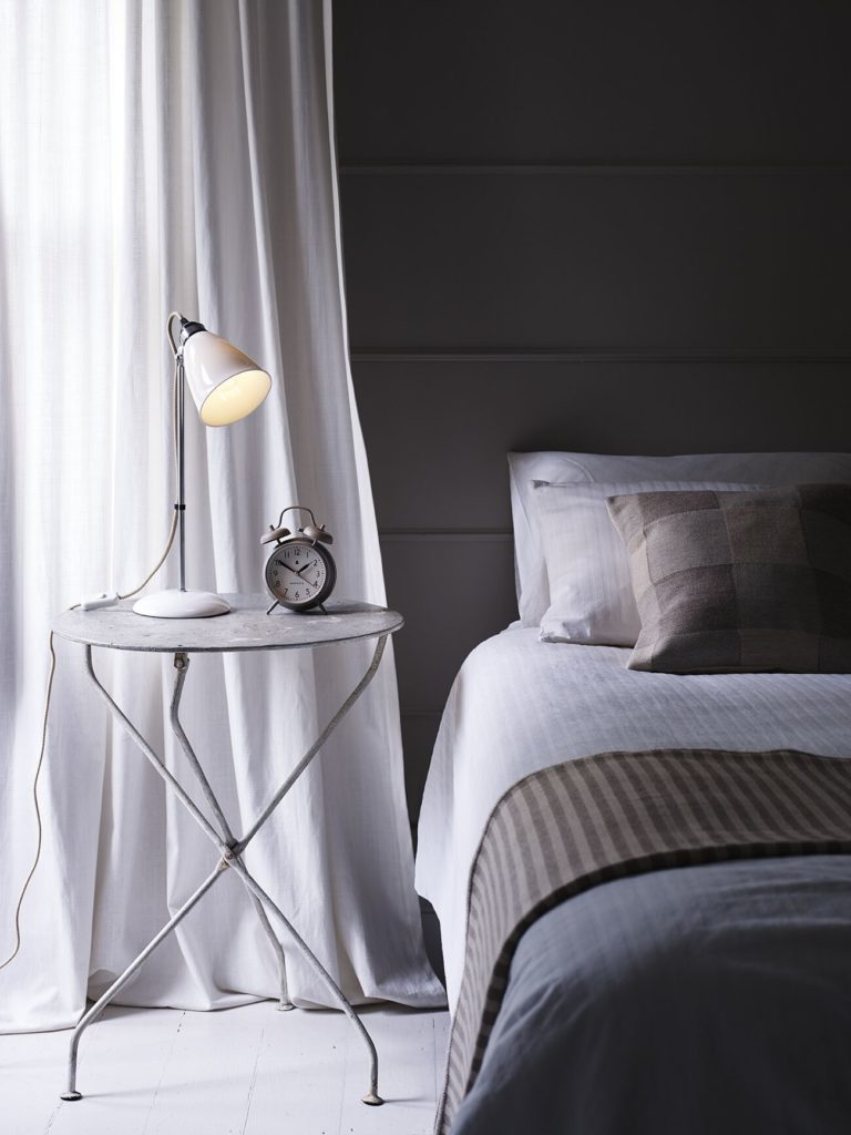 Original BTC Hector table lamp with chrome stem and white cord in bedroom