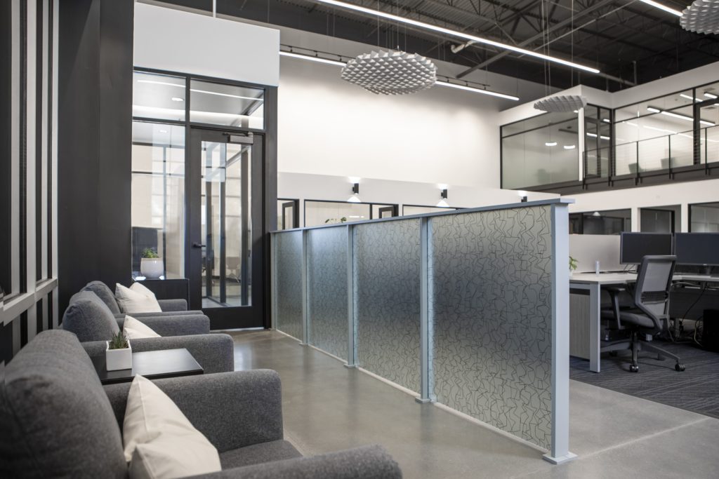 3form's Varia Design Collection privacy panels in office with black and white color scheme
