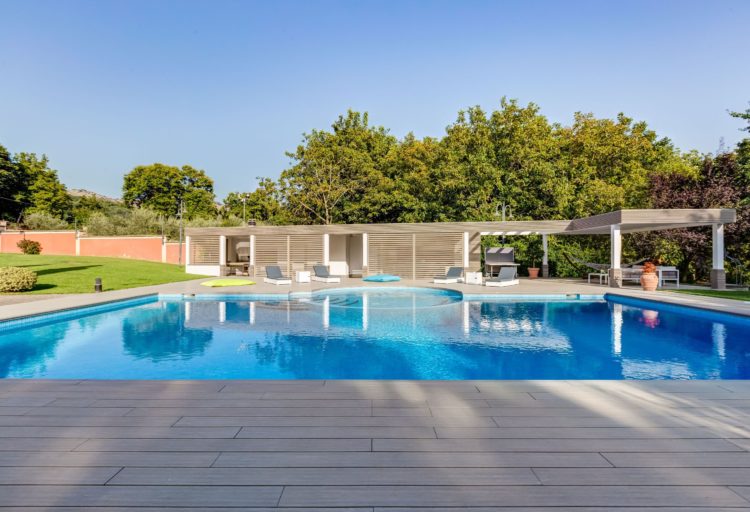 UltraShield by Déco view with deck in foreground pool in middle and veranda in background