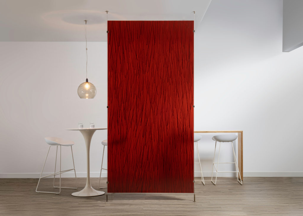 3form's Varia Design Collection privacy panel in red with black lines with cafe tables and chairs