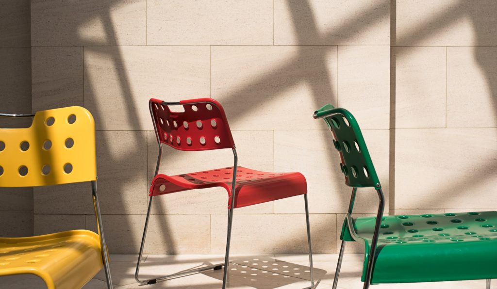 Sandler Stak Chair yellow, red, green on outdoor patio