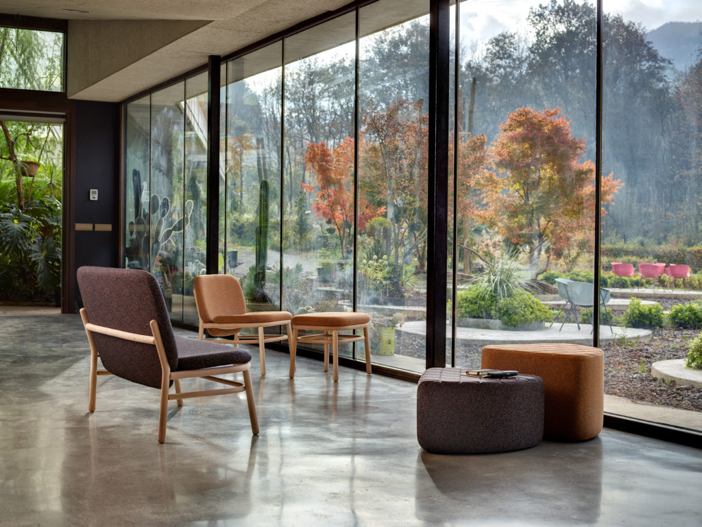 Hightower's Lana Seating sofa and chairs in front of window with nature view