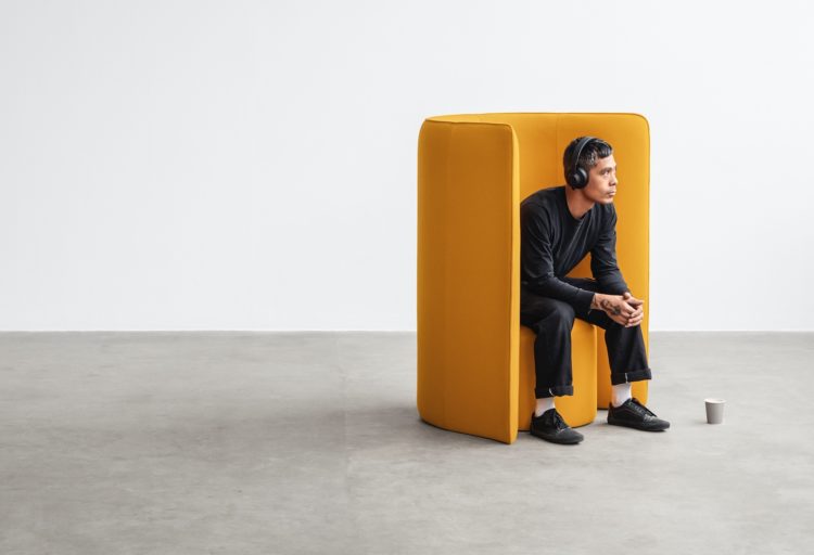 Hightower's Proto Lounge yellow with seated man