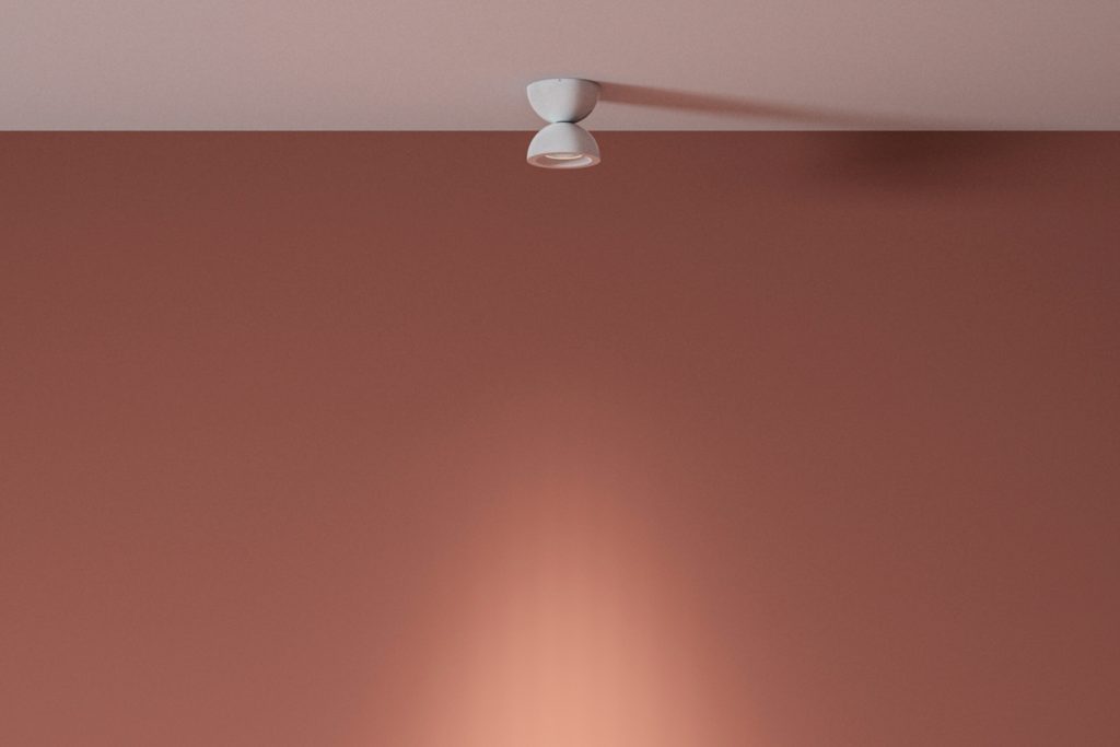 Axolight's DoDot white ceiling with salmon colored wall behind