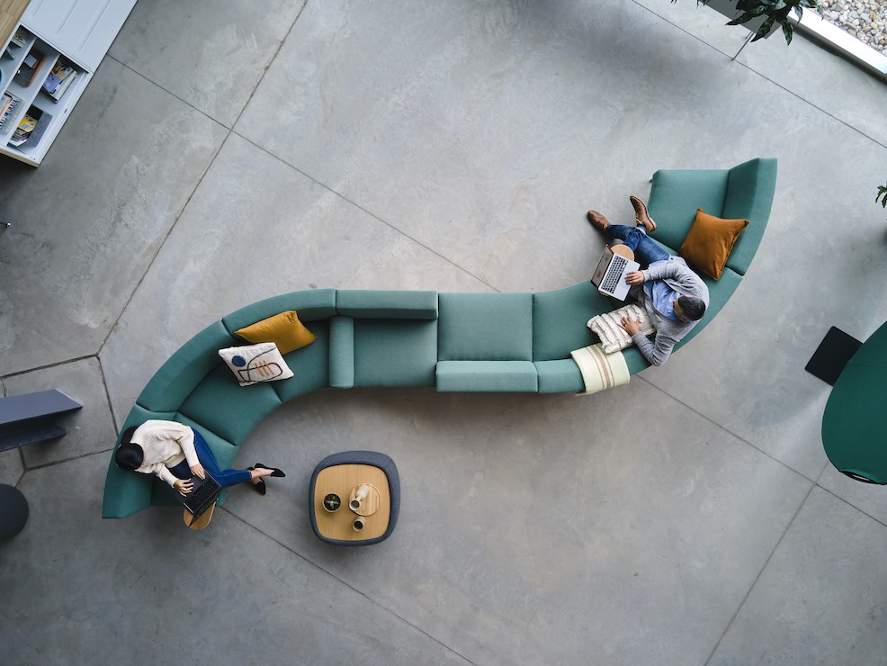 Jetty:Mod by Allsteel sofa with curved elements and two people view from above