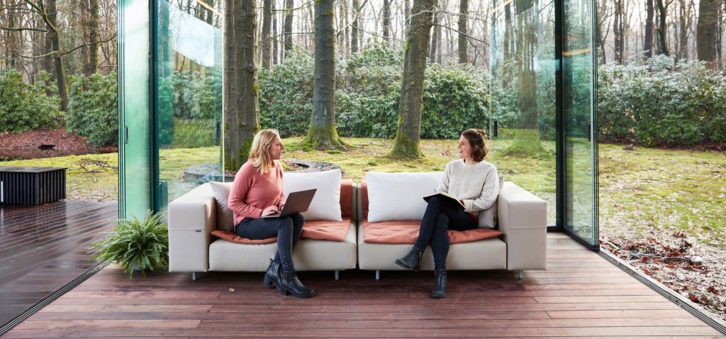 Extremis Walrus Sofa on deck with two women