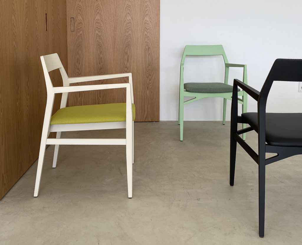 Aya chair in black, green, and natural