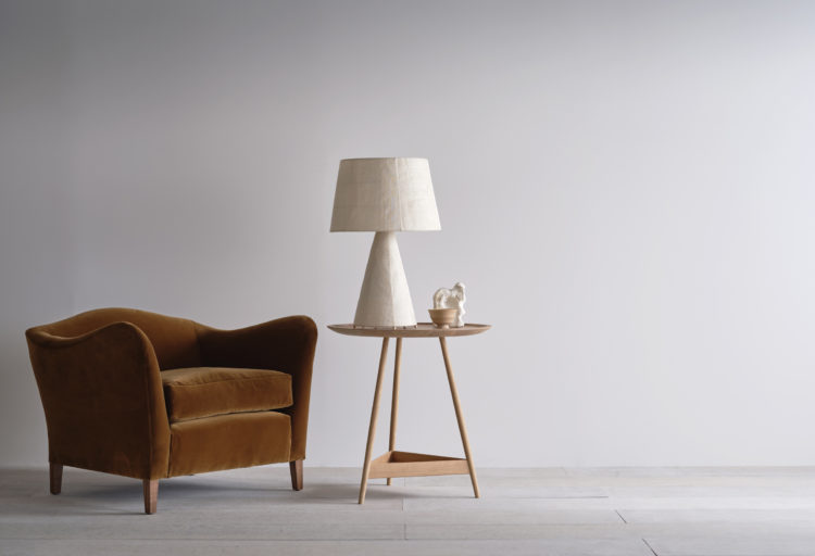 Pinch Lighting Gentle Table Lamp on low table near sofa