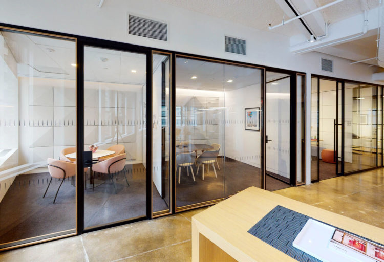 Muraflex Quadro Architectural Glass Partition black finish with walnut trim in NY showroom